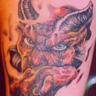 Horned Devil with Piercing Eyes Tattoo