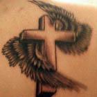 Wings Wrapped Around a Cross Tattoo