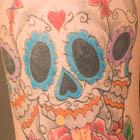 Three Sugar Skull Tattoos with Rose and Dagger