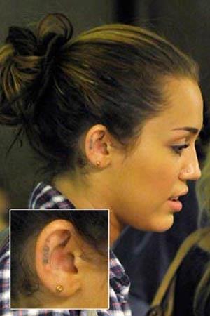 Miley Cyrus love ear tattoo Miley Cyrus Love Ear Tattoo