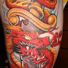 Red Asian Dragon with Dagger Tattoo