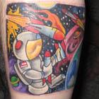 Astronaut Playing With Rockets Tattoo