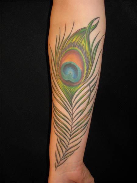 peacock feather arm tattoo Peacock Feather Arm Tattoo